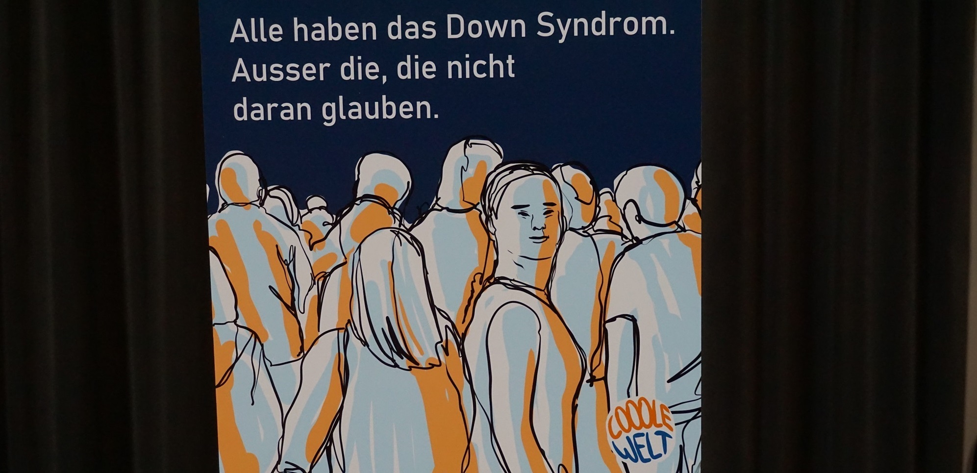 Auf dieser Illustration steht: "Alle haben das Downsyndrom. Ausser die, die nicht daran glauben."